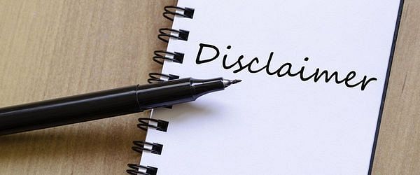 Black pointy pen on a notebook with "Disclaimer" word written on a it.