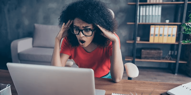 Shocked woman looking at the laptop screen