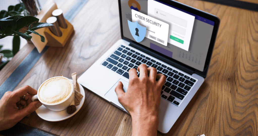 Hands type on a laptop featuring a prominent cybersecurity shield icon, emphasizing the technical safeguards required to secure the broader digital ecosystem.
