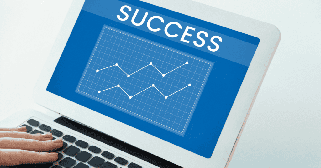 A close-up of hands typing on a laptop displaying a rising line graph and the word "Success," visualizing the upward trajectory of a well-executed plan.